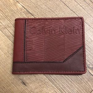 Calvin Klein maroon wallet.